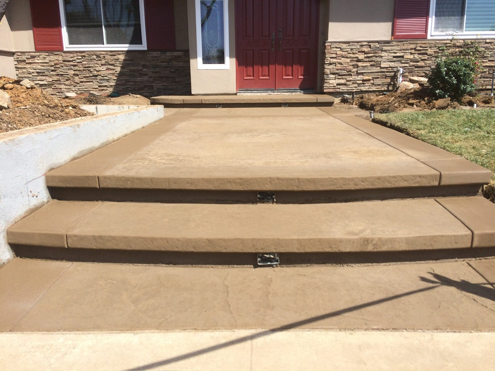 Stamped concrete entry steps and walkway