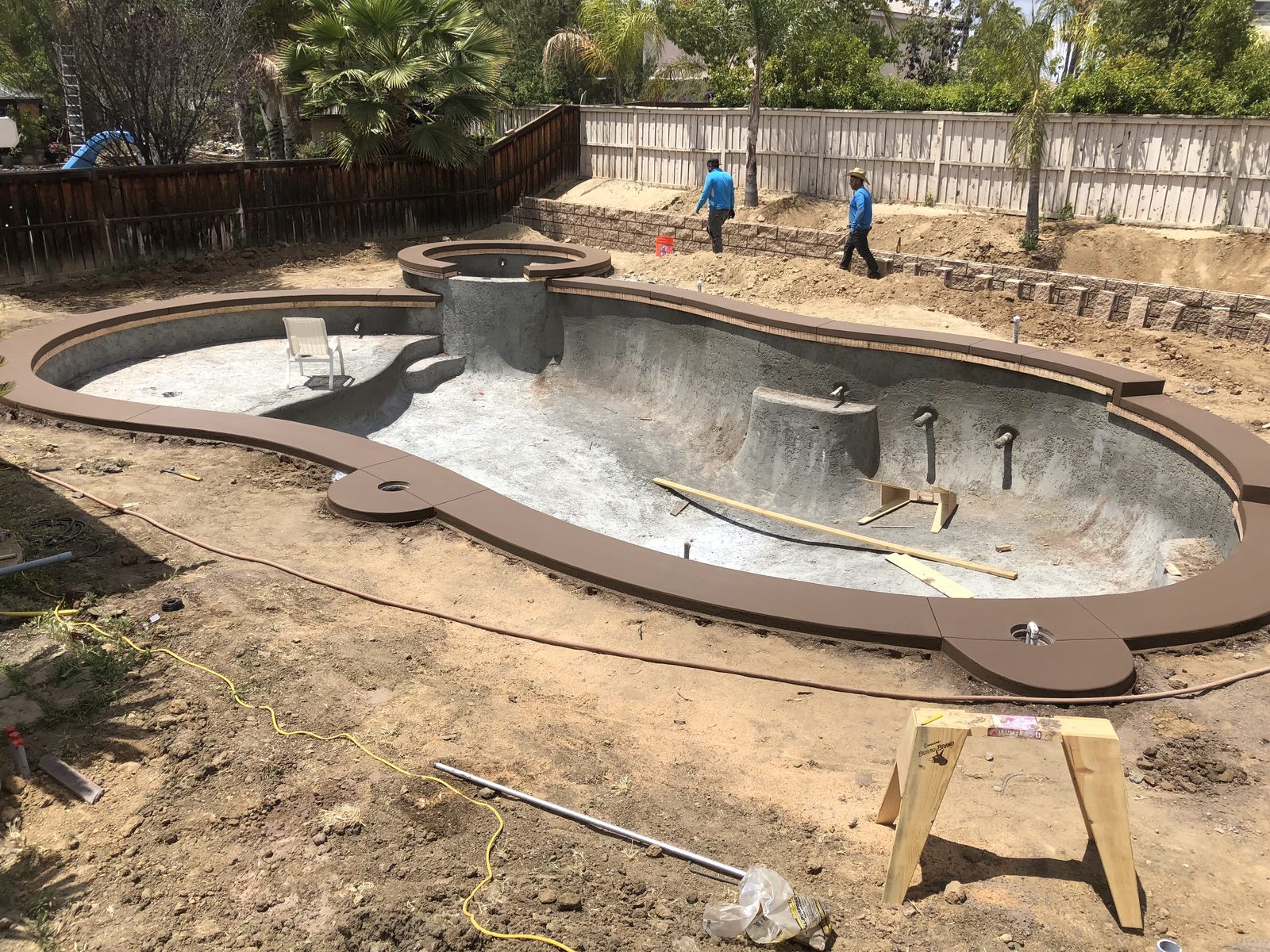 Concrete pool surround and coping under construction